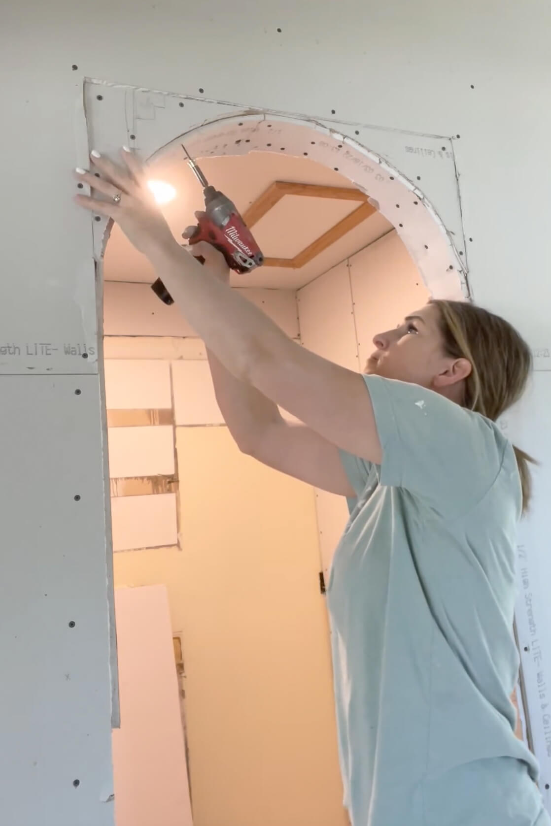 Adding drywall to an arched doorway. 